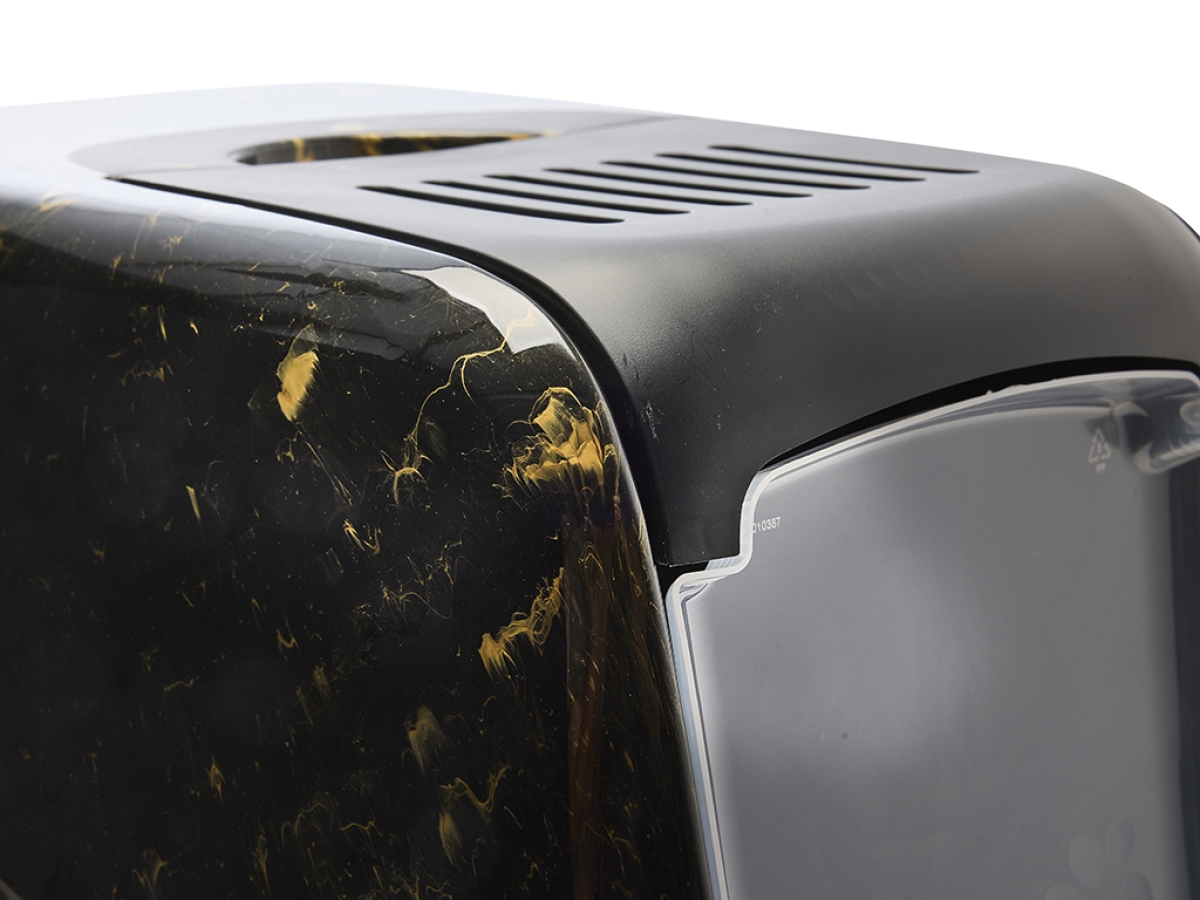 Detail view of Savic Nestor Marble cat litter box in black and gold marble finish with folding front and carbon filter